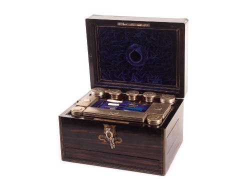 A Victorian Macassar ebony lady’s fitted travel case, complete with silver plated necessaires de toilette, and having a hidde