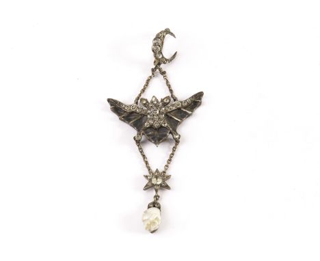 An Art Nouveau plique a jour bat pendant, the bat with spread enamel wings and encrusted with paste stones supporting a drop 