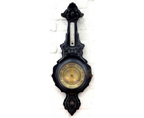 A CARVED AND STAINED MAHOGANY ANEROID BAROMETER, 84CM 