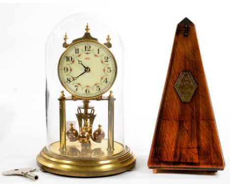 A FRENCH WALNUT METRONOME AND A BRASS ANNIVERSARY CLOCK
