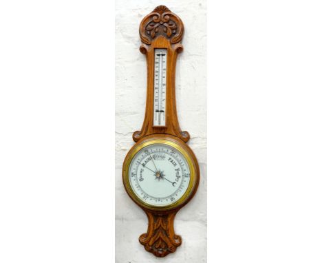 A CARVED OAK BAROMETER, 82CM H AND AN EMBOSSED COPPER COAL BIN, 48CM H; 28 X 34CM 