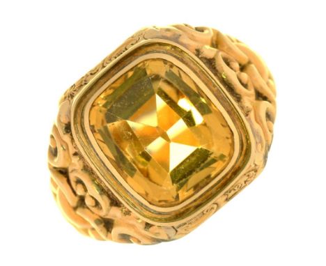 A CITRINE SIGNET RING IN GOLD, WITH CHASED SHOULDERS, UNMARKED, 8.5G, SIZE X½++LIGHT WEAR CONSISTENT WITH AGE, TESTING MARK