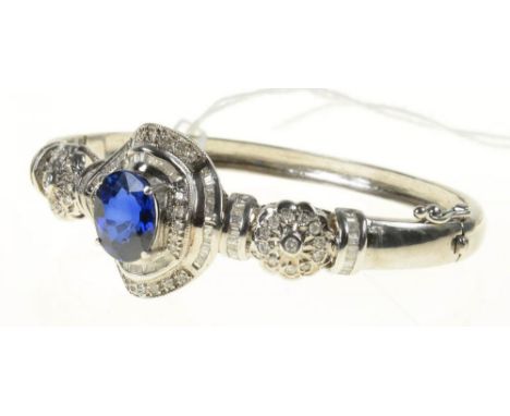 A SYNTHETIC SAPPHIRE AND DIAMOND BANGLE, THE BAGUETTE AND BRILLIANT CUT DIAMONDS APPROX 1.5CT, IN WHITE GOLD, MARKED 14K, 24G