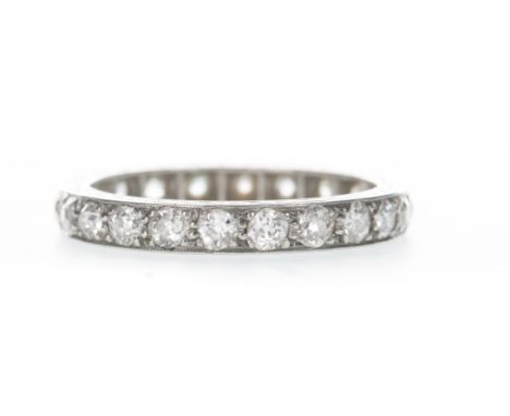 DIAMOND ETERNITY RING, set with old cut diamonds totalling approximately 1.70 carats, with engraved decoration to the edges, 