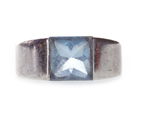 CARTIER TANK RING, set with a square blue gem 8mm wide, numbered 15500, marks worn, hand engraved with 'CTIER 1997' marked 75