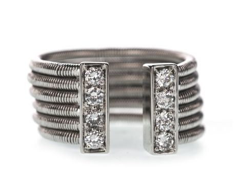 DAVID MORRIS DIAMOND RING, of torque form, with six sections and diamond set terminals, the round brilliant cut diamonds tota