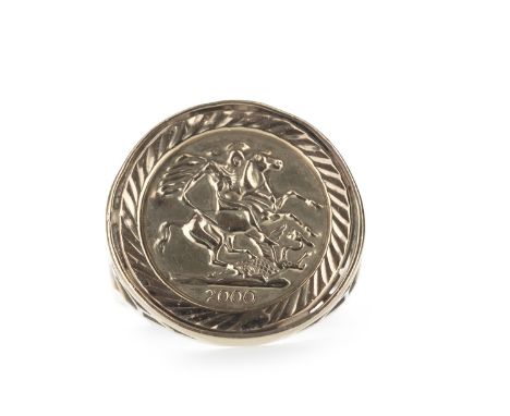 GOLD SIGNET RING, set with a replica half sovereign, in nine carat gold, size X, 3.2g