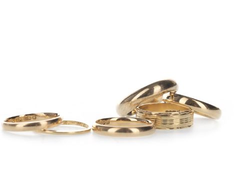 FIVE EIGHTEEN CARAT GOLD WEDDING RINGS, of various sizes, 16g gross, and one nine carat gold ring, 6.4g (6)
