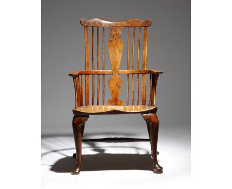 A mid-18th century and later yew Windsor armchair attributed to John Pitt, the comb back above a burr vase shape splat, with 