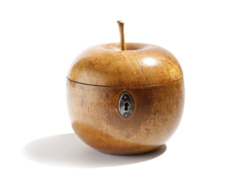 A treen fruitwood tea caddy in the form of an apple, with a stalk finial, the formerly hinged lid revealing an interior with 