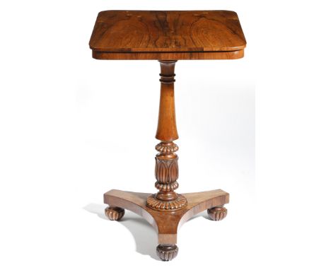 λ A George IV rosewood lamp table in the manner of Gillows, with a turned baluster and lappet carved stem, with nulled decora