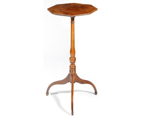 A Regency yew wine table, the octagonal fixed top with a reeded edge, above a baluster turned stem, on tripod legs, 74.5cm hi