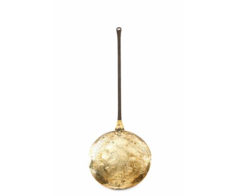 A Charles II brass warming pan, with an iron handle and a pierced hinged lid, the centre engraved with the Royal Coat of Arms