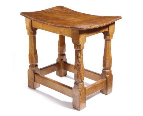 Robert 'Mouseman' Thompson (1876-1955). An oak joint stool, with a burr dished top, on faceted baluster legs united by periph