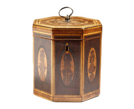 A George III harewood octagonal tea caddy, inlaid with stringing and tulipwood and planewood banding, the hinged lid with a w