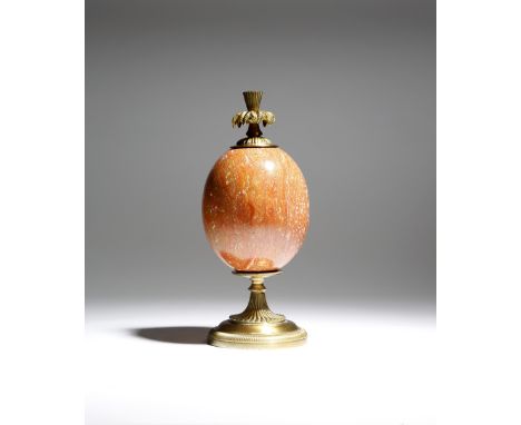 A French marble and gilt brass ornament attributed to Maison Charles, the egg shaped body with a screw-off leaf finial, the b