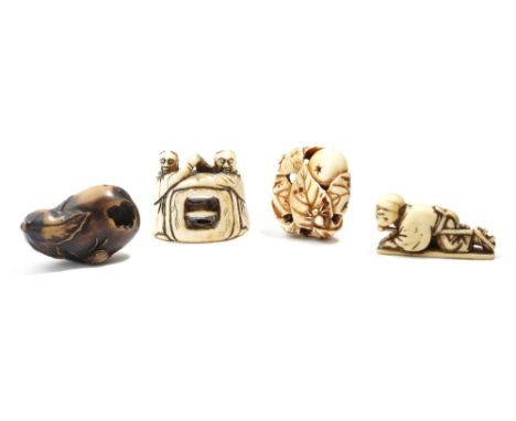 λ Three Japanese ivory netsuke, two carved with figures, the other with leaves, fruit and a spider, one signed, together with