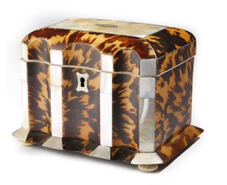 λ An early Victorian tortoiseshell tea caddy, of sarcophagus shape, inlaid with pewter stringing, the mother of pearl inset h