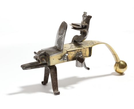An 18th century brass and steel flintlock tinder pistol lighter, the handle engraved with a recumbent stag and scrolls, 19cm 