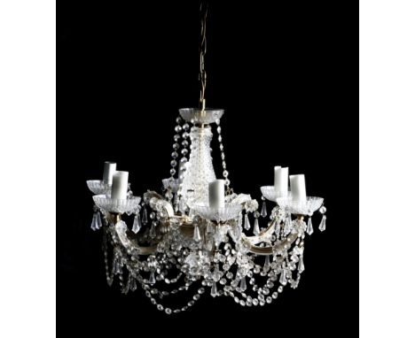 A pair of gilt brass and glass six-light chandeliers, hung with drops, each with a baluster stem, above scroll branches appli