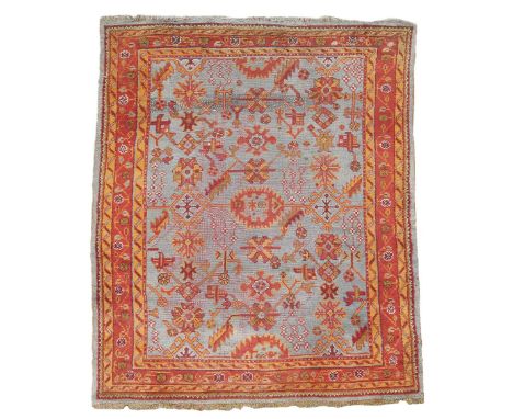 An Ushak carpet, West Anatolia, early 20th century, 302 x 216cm.