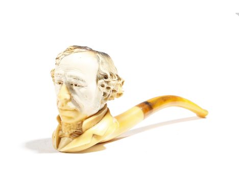 A Victorian Meerschaum pipe by Freidrich Edwards, the bowl carved with a portrait bust of Benjamin Disraeli (1804-1881), with