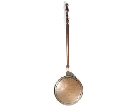Horse racing interest. A George II folk art copper warming pan, with a turned fruitwood handle, the hinged lid pierced and na