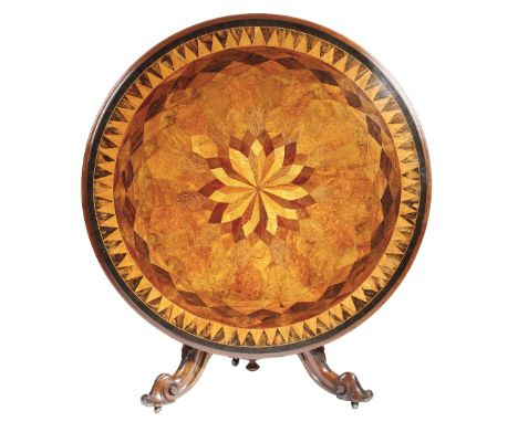 λ A Victorian walnut and specimen wood centre table, the circular tilt top parquetry inlaid with various woods, including: pa