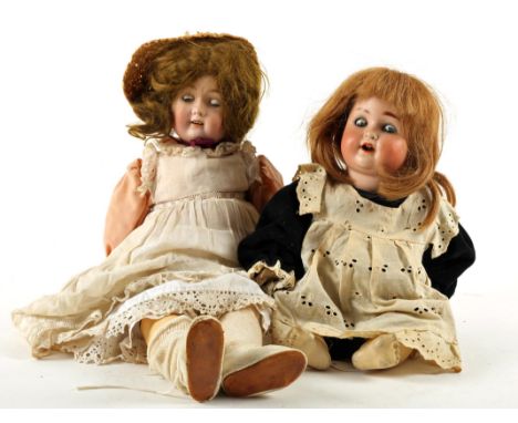 A W. Goebel bisque socket head doll, with blue glass sleeping eyes, open smiling mouth with four top teeth, brown wig, jointe