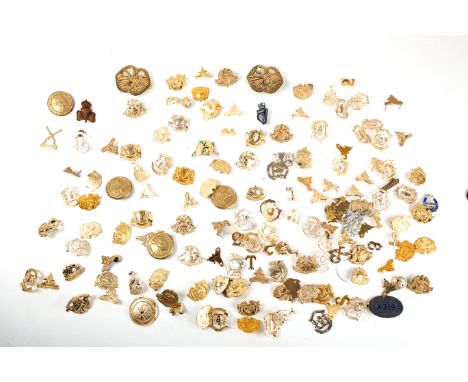 A collection of Irish Army collar and cap badges. Approximately 120 anodised aluminium collar badges, unit numerals and lette
