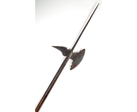 17th century halberd, the forged steel, crescent-shaped axe-head surmounted by a spike and with edged and serrated 'thorn' on
