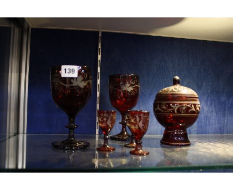 A selection of ruby-flashed glass, to include five glasses and a pot with cover -6 Best Bid