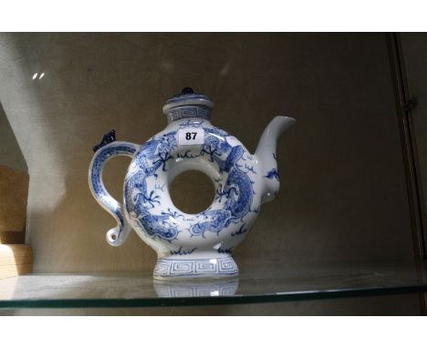 A modern Chinese blue and white teapot, ring shaped, 25cm high