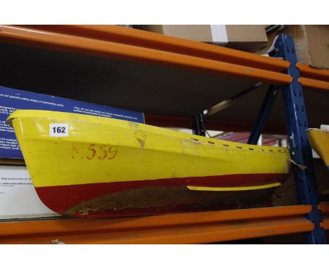 A TINA RC model sailing dinghy, boxed, a Robbe 'Jollie' model sailing dinghy, boxed, a model boat (AF) and a model ship (AF) 