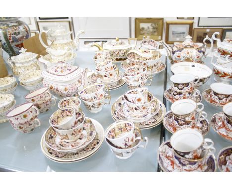 A quantity of 19th Century part services to include a pink lustre teapot and four matching teacups, strawberry decorated, a C