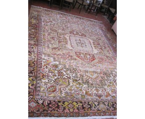 A Heriz carpet with central medallion and allover decoration approx 13 x 12 foot