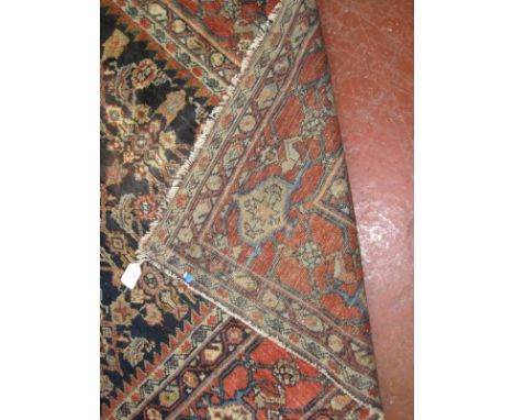 A Sultanabad type carpet, the indigo field with allover 'hepati' decoration worn and mothed approx 12.6 x 10.6 foot