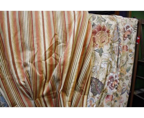 A pair of printed chintz cotton curtains approx drop 260cm together with a pair of GP & J Baker striped curtains approx drop 