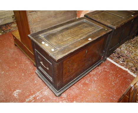 A 19th century continental oak coffer with a marquetry pictorial front panel.