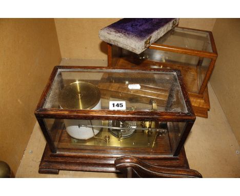 An early 20th Century oak cased barograph, 19cm high, a cased set of balance scales and an empty barograph case (AF) -3