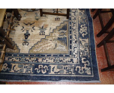 A Chinese carpet 113 x 74 inches (very worn, tears, etc.)