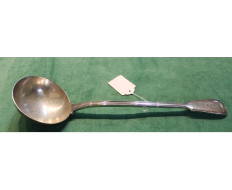 A silver ladle with engraved crest, London 1919