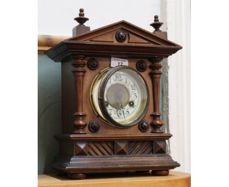 A mahogany striking mantel clock