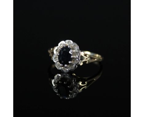 A 9ct gold sapphire and diamond cluster ring, size R