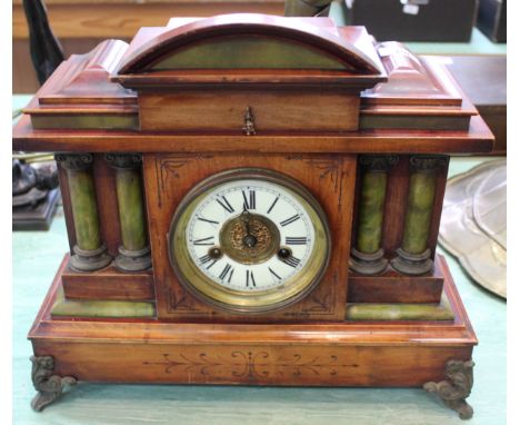 A German stained and painted wood striking mantel clock