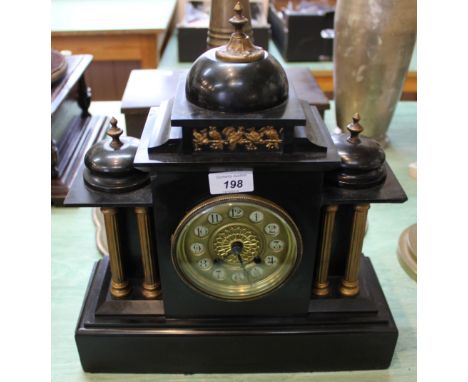 A black marble and gilt metal mantel clock