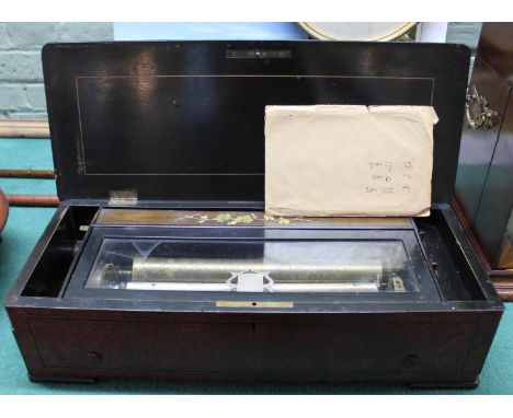 A Swiss music box in inlaid burr walnut case playing 8 airs with accompanying card naming airs