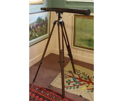 A brass telescope on wooden tripod from the Peninsula Hotel Hong Kong