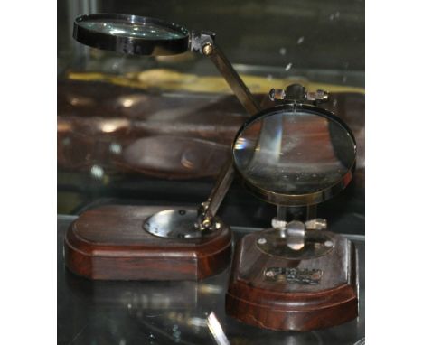 A pair of reproduction desk magnifiers 