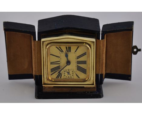 A 1930's French brass travel alarm clock by Brevete, in original case (working)